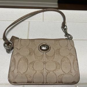 Gentle used wristlet, tan signature design